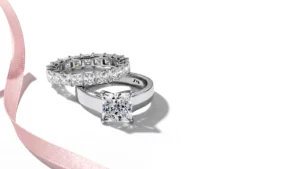 Gordon Max ring styled with ribbon gift packaging.
